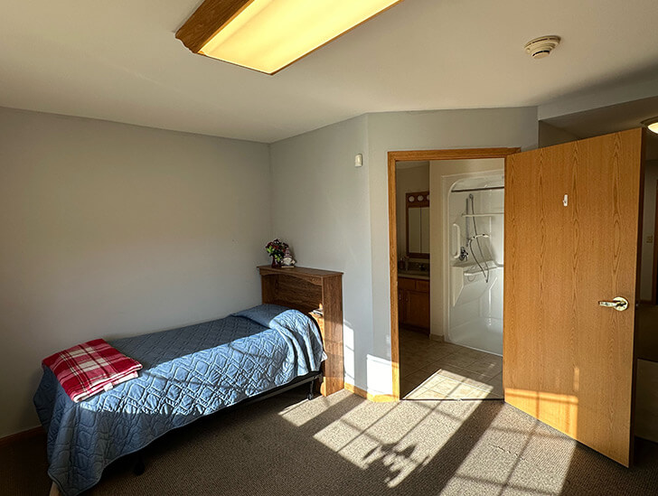 Assisted living apartment bedroom at Good Samaritan Society - Bloomfield.