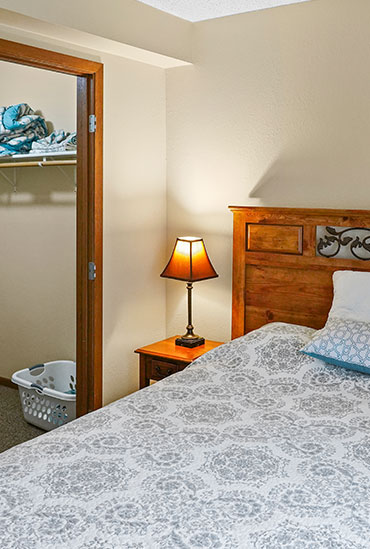 The main bedroom in a 2 bedroom assisted living apartment at Good Samaritan Society - Woodland in Brainerd, MN.