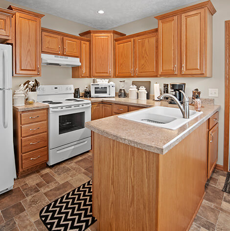Independent living residents can enjoy a spacious full-size kitchen with island at Good Samaritan Society - Hastings Village in Hastings, Nebraska.