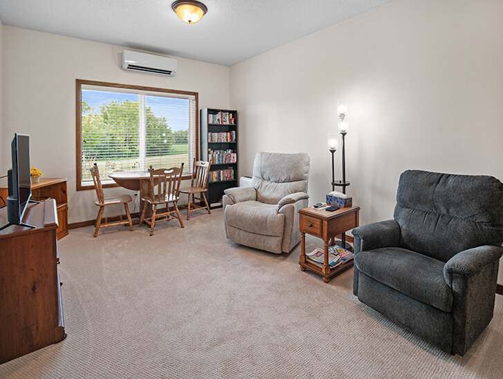 Spacious assisted living apartment living room at the Lodge of Howard Lake in Howard Lake, Minnesota.