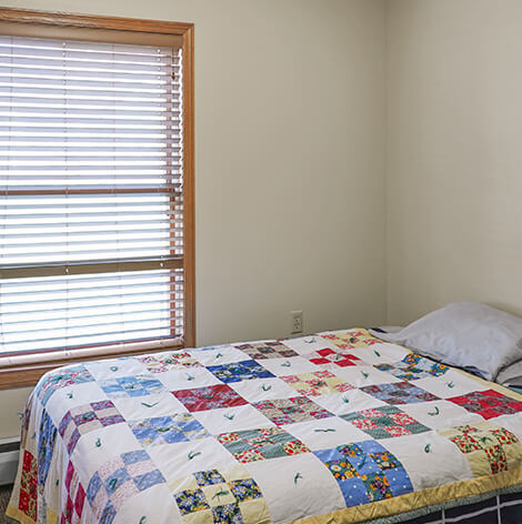Independent living apartment bedroom at Good Samaritan Society - Pine River