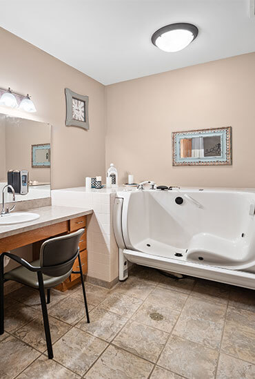 Walk-in spa tub in the bathroom of an assisted living apartment at Good Samaritan Society - Sioux Falls Village