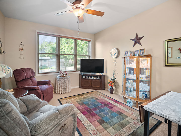 Living room of an assisted living apartment at Good Samaritan Society - Sioux Falls Village