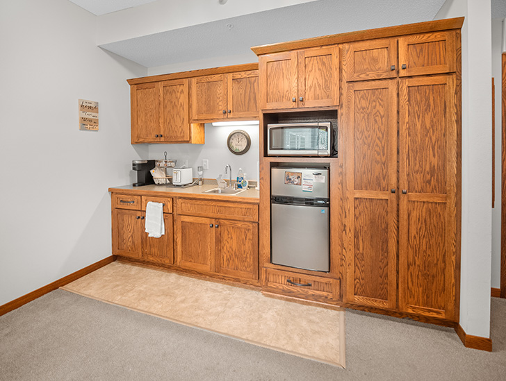 Assisted living apartments feature a kitchenette at The Lodge of Winthrop in Winthrop, Minnesota.
